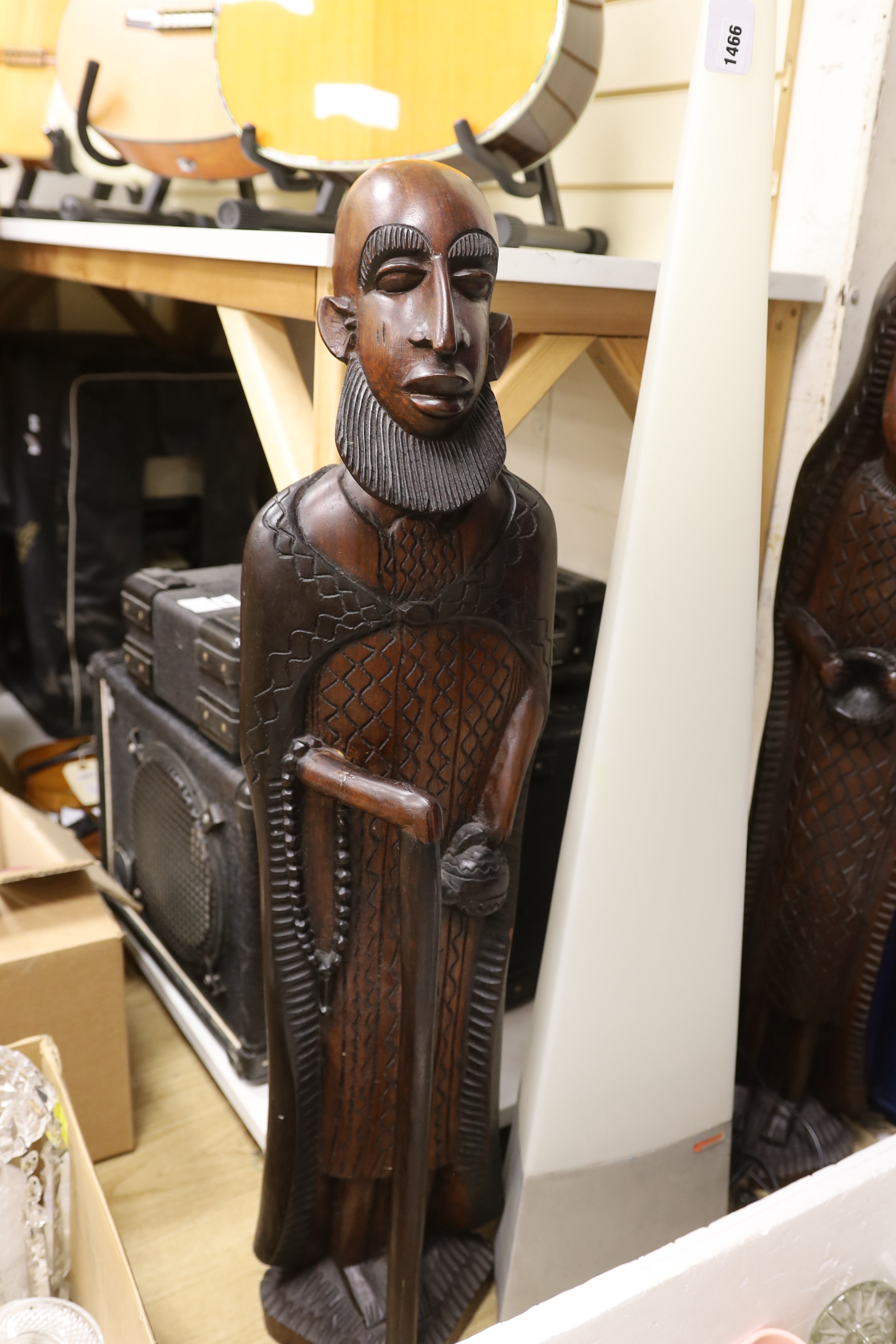 A pair of large African hardwood figural carvings and a Mathmos floor lamp